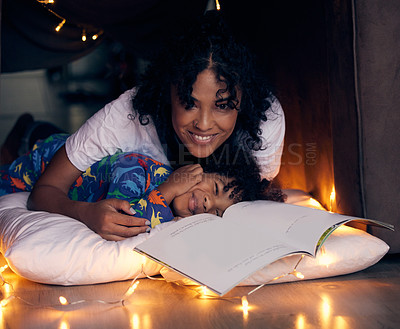 Buy stock photo Reading, bedroom and portrait of kid with mom in home, smile and child together with mother for love. Young boy, pyjamas and storytelling with woman, night and relax on weekend and happy for book