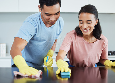 Buy stock photo Cleaning, table and couple together in kitchen with cloth for hygiene, dirt removal and protection from bacteria. Happy woman, scrub surface and man in apartment for helping with chemical and safety