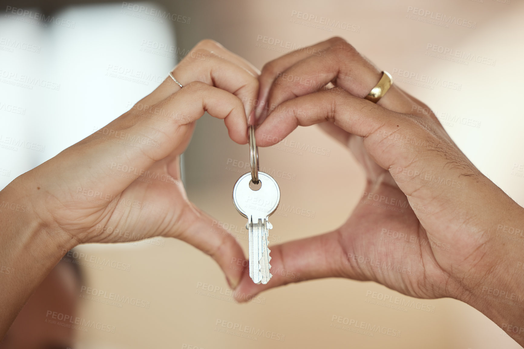 Buy stock photo Couple, heart and hands with keys for new home, investment and marriage in love for growth, care and support. Mortgage, people and sign together in house, apartment or property for building future
