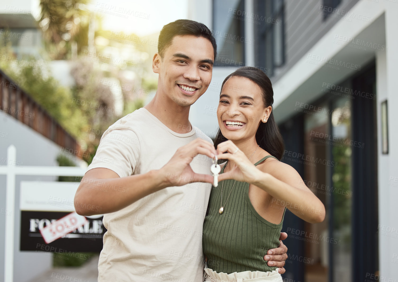 Buy stock photo Couple, new home and happy heart with key, property investment or purchase and mortgage with partners. Ownership, together and relationship achievement with house goal, sold or real estate buying