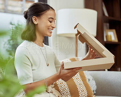 Buy stock photo Shot of a young woman about to eat her delivery food