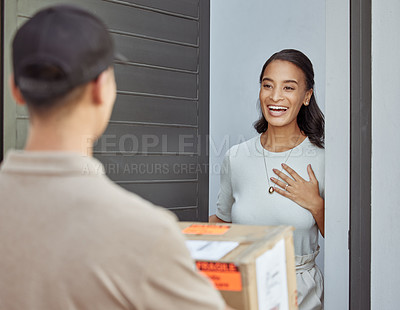 Buy stock photo Shot of a young woman receiving an order