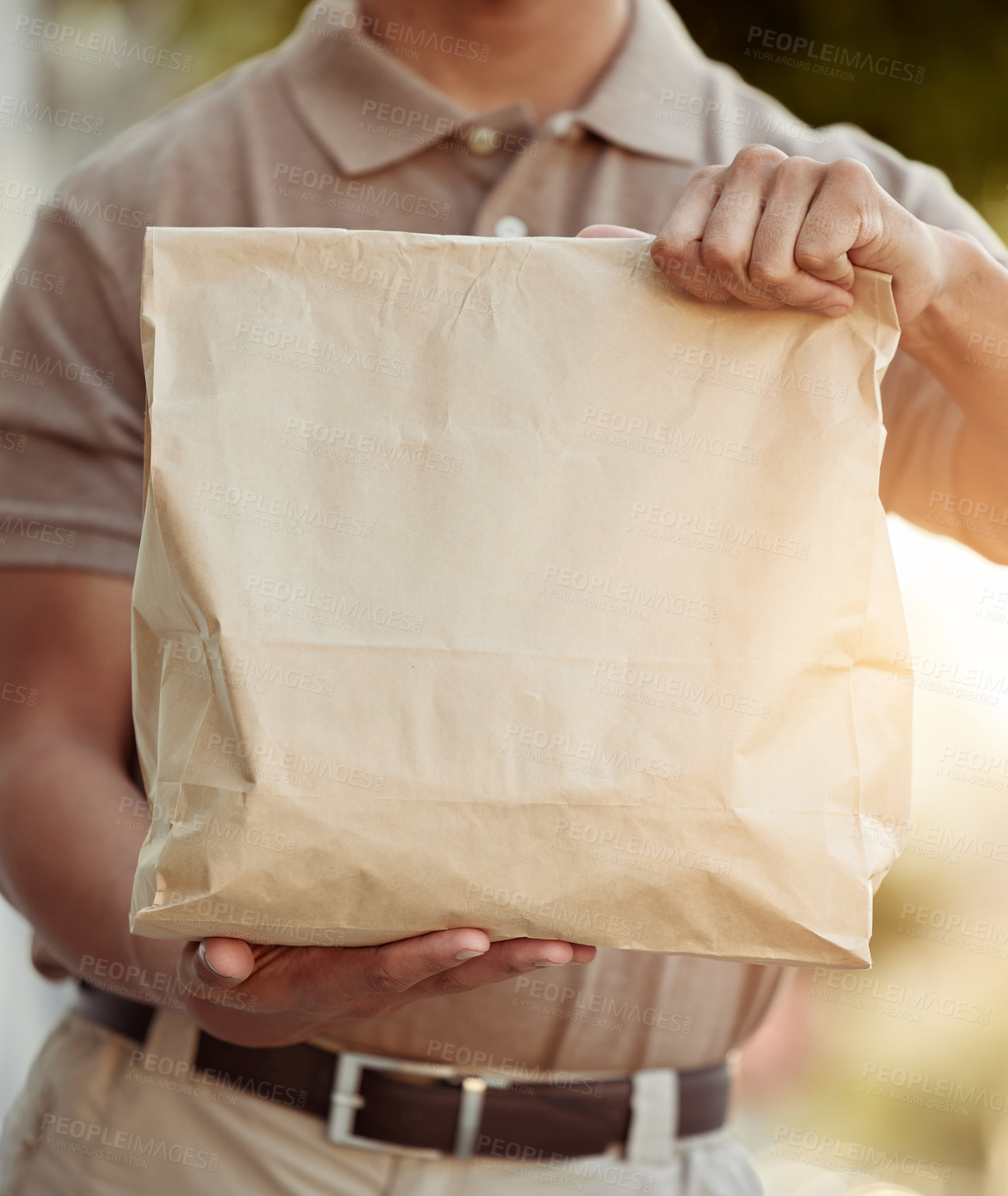 Buy stock photo Hands, package and delivery person with paper bag for food, ecommerce and drop off at customer. Online shopping, male courier and brown parcel outside for service, shipment and meal distribution