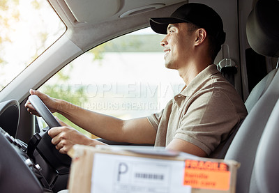 Buy stock photo Shot of a delivery man driving to drop off a package