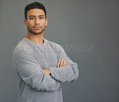 Buy stock photo Serious portrait of man in studio with mockup, arms crossed and model on studio backdrop in casual fashion. Relax, confidence and face of male on grey background with focus, pride and mock up space.