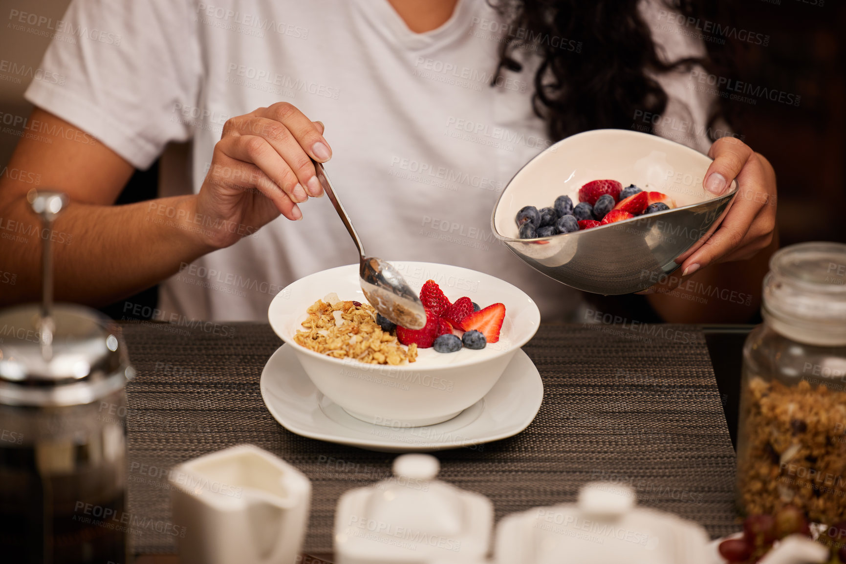 Buy stock photo Breakfast, hands and yogurt in a home with woman with brunch serving of cereal and fruit. Health, nutrition and diet brunch with bowl for eating healthy for weight loss in the morning with food