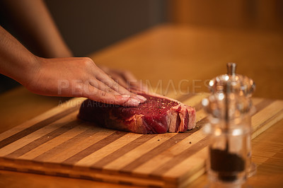 Buy stock photo Kitchen, cooking and hands of person with steak for meal preparation at lunch, dinner and supper. Chef, ingredients and closeup of meat for protein diet, wellness and nutrition on counter in home