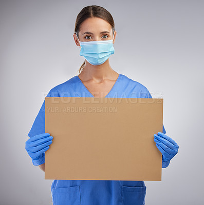 Buy stock photo Healthcare, portrait and nurse with poster, empty and mockup in studio, woman and information with mask. White background, help and medical professional with cardboard for advice and person in clinic