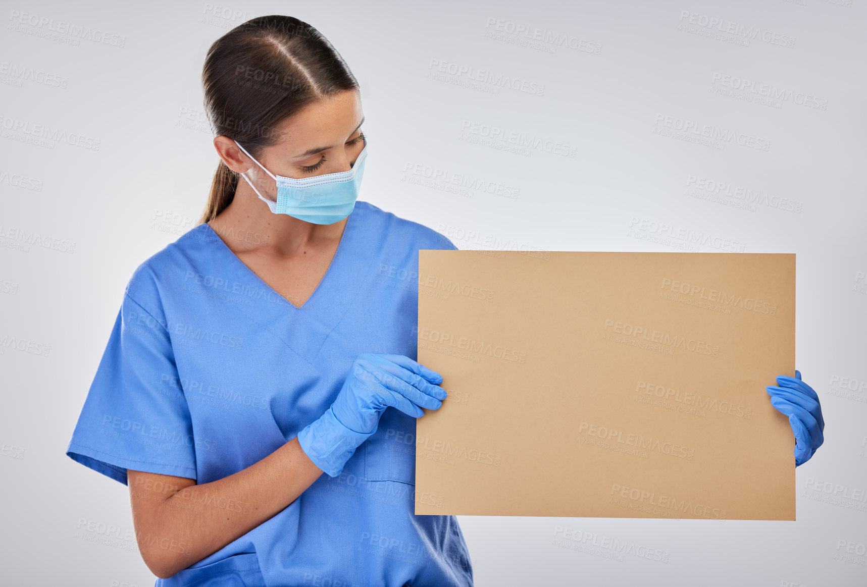 Buy stock photo Reading, nurse and mask with poster for healthcare, advertising or mockup in studio. Female doctor, sign and medical professional with board for signage, card and health awareness on white background