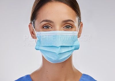 Buy stock photo Shot of a young female nurse against a studio background