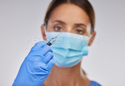 Buy stock photo Ppe, nurse or doctor with needle for vaccination, safety and medical practice in white studio background. Danger, healthcare worker or female person in scrubs for viral defence and protection