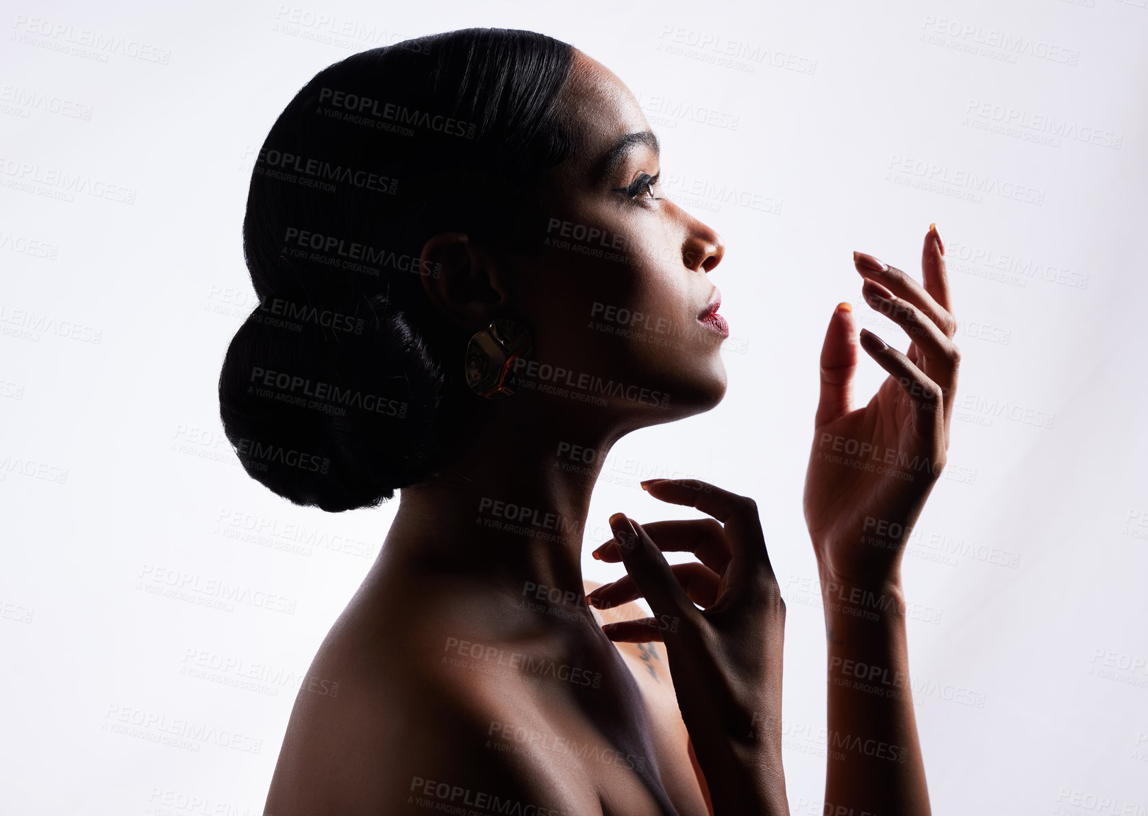 Buy stock photo Shot of an attractive young woman posing against a white background in the studio