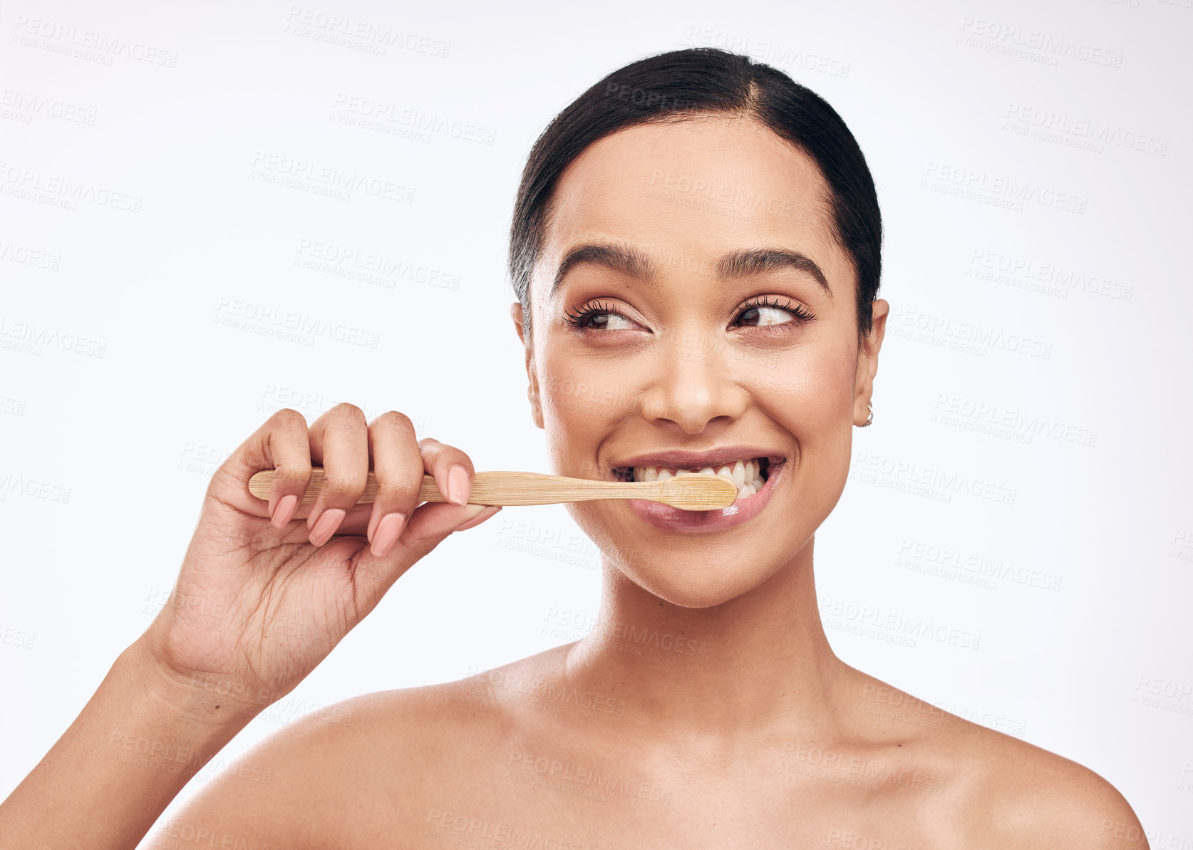 Buy stock photo Smile, woman and brushing teeth in studio for dental care, hygiene and fresh breath on white background. Bamboo toothbrush, happy and female person with thinking for cleaning, routine and wellness