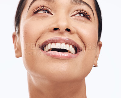 Buy stock photo Shot of a beautiful young woman smiling against a white background