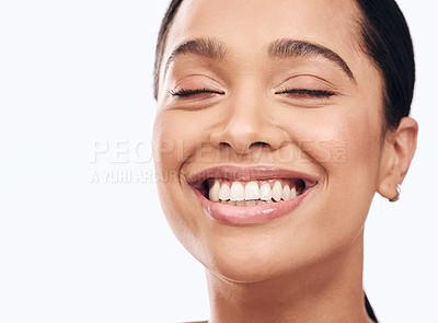 Buy stock photo Shot of a beautiful young woman smiling against a white background