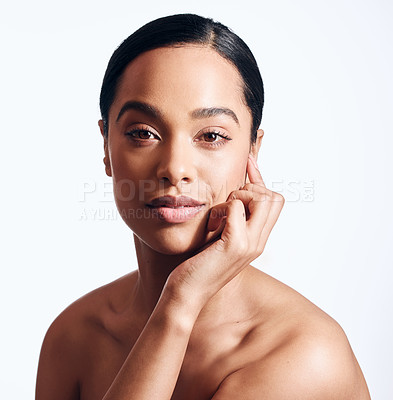 Buy stock photo Shot of a beautiful young woman posing against a white background