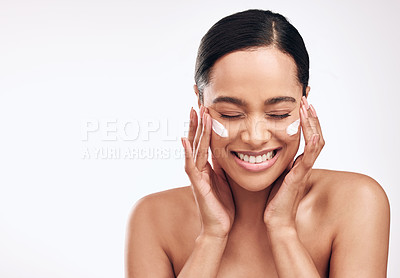 Buy stock photo Woman, skincare and cream in studio for wellness, dermatology and cosmetics for beauty. Collagen, moisturizer and lotion for face by white background for glow, self care and facial with mockup space