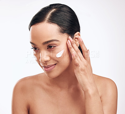 Buy stock photo Woman, skincare and face cream in studio for wellness, dermatology and cosmetics for beauty. Collagen, moisturiser and lotion for female person by white background for glow and self care with product