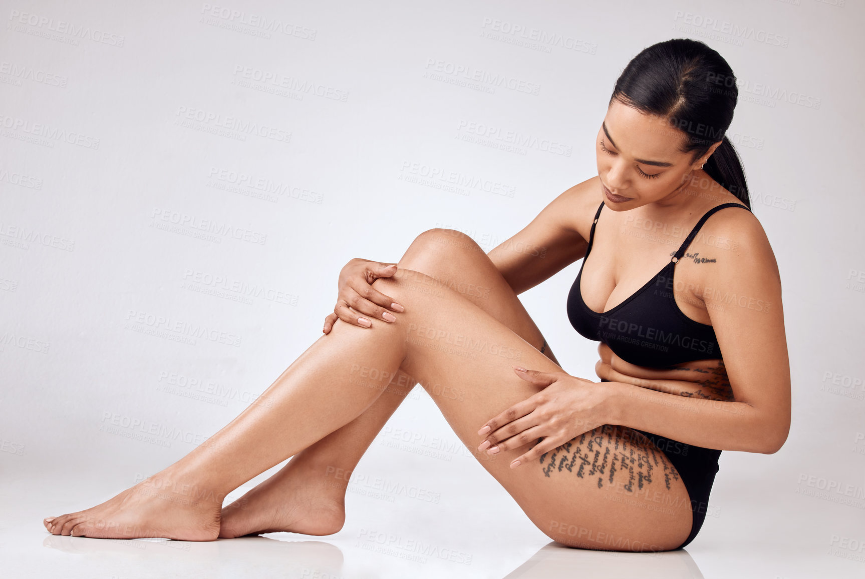 Buy stock photo Woman, skincare and legs of person in studio, selfcare glow and laser hair removal, cosmetics or natural and smooth treatment. Skin, grooming shine and spa body, waxing and model feet on background