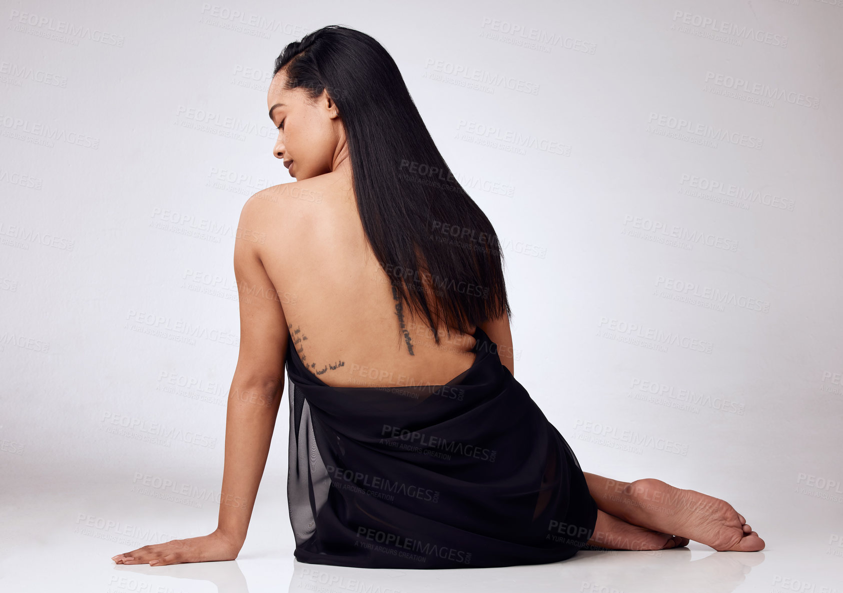 Buy stock photo Beauty, skincare and back of woman in studio, selfcare glow and bodycare, cosmetics or natural and smooth treatment. Skin, grooming shine and fabric, dermatology and model on floor or background