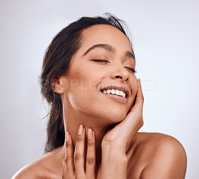 Buy stock photo Beauty, smile and hands on face of woman in studio for skincare, treatment and glowing skin on white background. Dermatology, wellness or Mexican model with cosmetic, shine and texture satisfaction