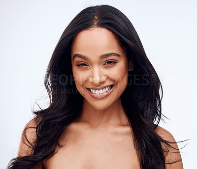 Buy stock photo Studio portrait of a beautiful young woman posing against a grey background