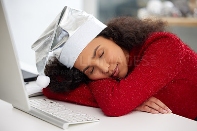 Buy stock photo Shot of a young woman taking a nap while working at home