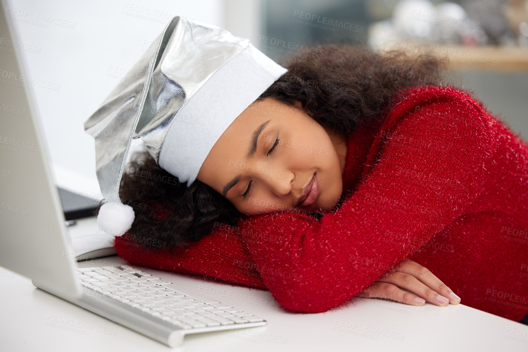 Buy stock photo Woman, desktop and Christmas hat with fatigue or sleeping in work from home on table for holiday. Female person, tired and rest in office with technology in house for freelance, copywriting or job