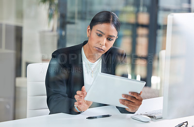 Buy stock photo Business woman, tablet and typing in a office with web designer working on ui information. Internet research, young female worker and thinking of a employee on a app for digital project and work