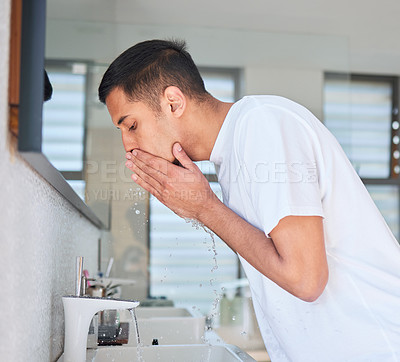 Buy stock photo Man washing face, hygiene and beauty in bathroom, skincare and cleaning skin with water for morning routine. Male person at home, grooming and natural cosmetic care with clean facial and hydration