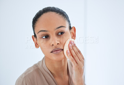 Buy stock photo Beauty, face and woman doing a scrub for skincare, self love and cosmetic care for natural skin in the morning. Bathroom, cleaning and young female person clean or grooming with a product or sponge