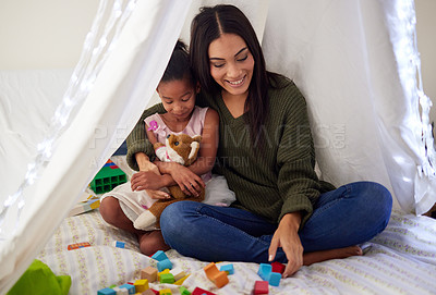 Buy stock photo Tent, blanket and mother play with girl for bonding, quality time and child development at home. Family, relax and happy mom with child playing with educational toys, building blocks and shapes