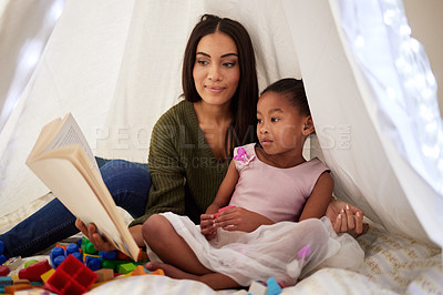 Buy stock photo Tent, reading and mother and girl with book for bonding, quality time and child development. Family home, relax and happy mom with child read fairytale, literature and story in blanket Fort on floor