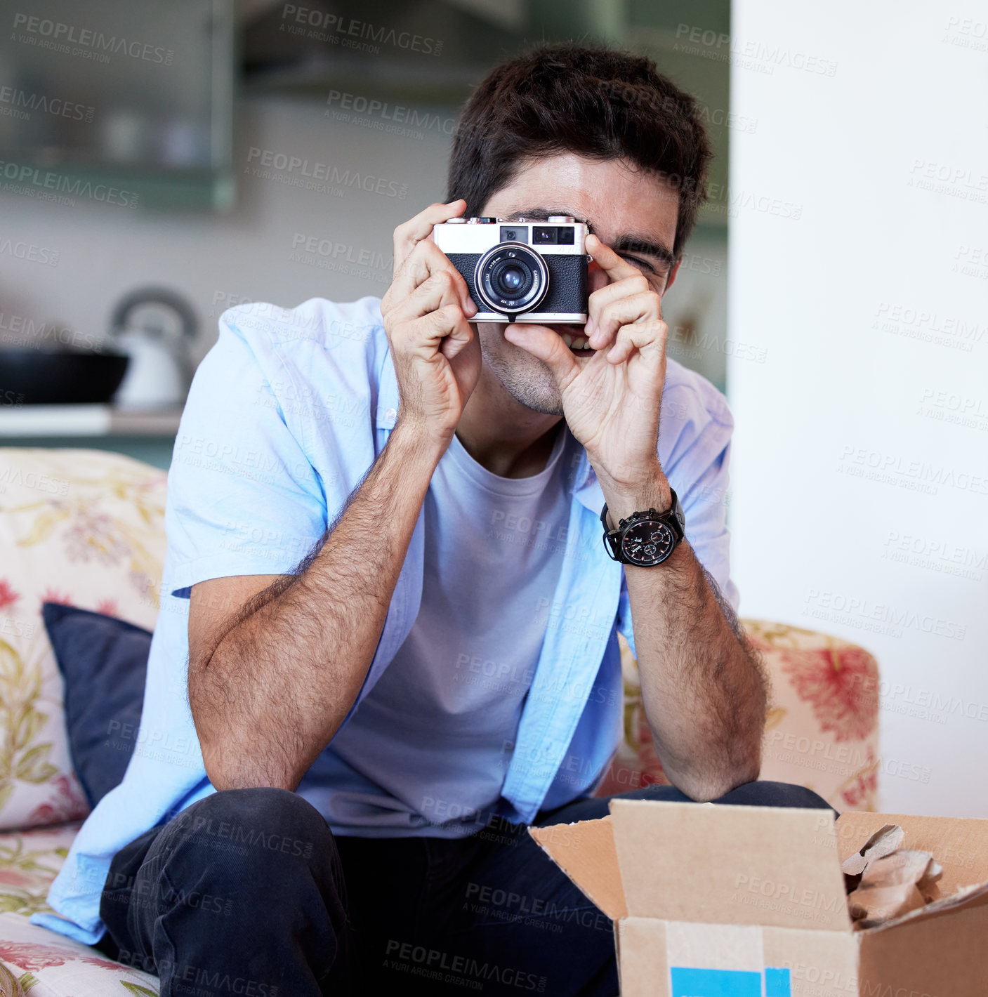 Buy stock photo Shot of a young man taking a photo with his camera