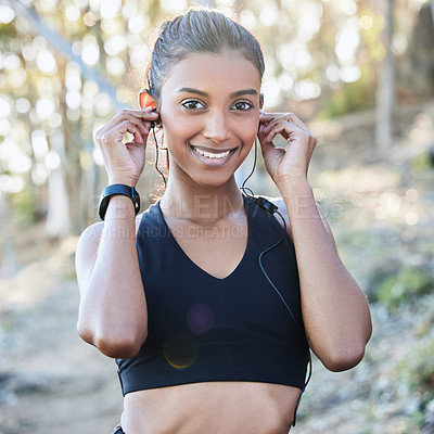 Buy stock photo Fitness, earphones and portrait of a woman in nature after running for race or marathon training. Sports, exercise and female athlete listening to music, radio or podcast for cardio workout in woods.