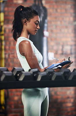 Buy stock photo Personal trainer, gym or woman writing dumbbells or checking weights info for inspection checklist. Fitness business, girl or entrepreneur with inventory documents for training equipment monitoring