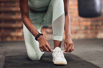 Buy stock photo Tie, start or hands of woman with shoes at gym for training, exercise or workout motivation in fitness center. Lace, closeup or legs of girl sports athlete with footwear ready to begin exercising 
