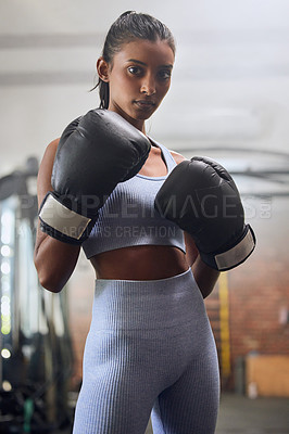 Buy stock photo Young indian woman, boxing gym and portrait in gloves for fight, training or workout for health. Athlete girl, box club and exercise for conflict, performance and power with wellness, sport and goals