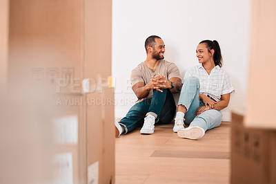 Buy stock photo Happy, couple and real estate with box for moving house, mortgage and trust with commitment. Excited, man and woman with cardboard package sitting in apartment and home for family property investment