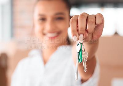 Buy stock photo Shot of a woman holding up the key to her new home