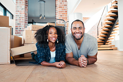 Buy stock photo Shot of a man and his daughter lying on the floor in their new home