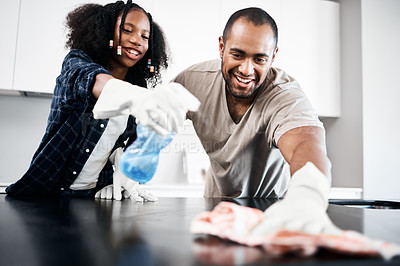 Buy stock photo Father, girl and cleaning and home together, teaching and cleanliness for hygiene for germ protection or health. Helping, learning and disinfect for kitchen counter, happy and bond in family house