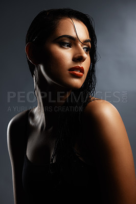 Buy stock photo Studio shot of an attractive young woman posing against a grey background