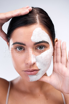 Buy stock photo Woman, portrait and clay mask in studio, beauty and half skincare to exfoliate on white background. Female person, half cosmetics and acne or facial treatment, cleaning detox and comparison of result