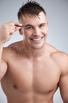 Buy stock photo Man, portrait and grooming eyebrow hair with tweezer in studio background with body, smile and skincare with hygiene. Wellness, cleanliness and beauty with hands and routine with confidence for face