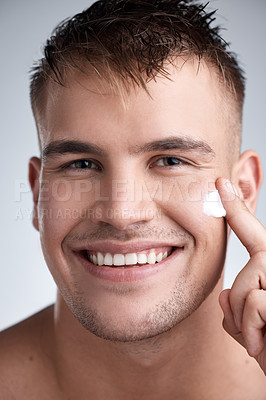 Buy stock photo Skincare, cream and portrait of man in studio with moisturizer for dermatology, wellness or treatment on white background. Closeup, smile and male model with lotion for grooming, routine or product 