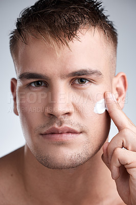 Buy stock photo Skincare, lotion and portrait of man in studio with moisturizer for dermatology, wellness or treatment on white background. Closeup, face and male model with cream for grooming, routine or product