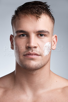 Buy stock photo Skincare, moisturizer and portrait of man in studio with cream for dermatology, wellness or treatment on white background. Hygiene, face and male model with lotion for grooming, routine or product