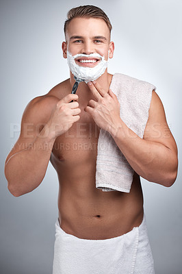 Buy stock photo Portrait, happy man and shaving in studio for grooming, maintenance and beard cream by backdrop. Male person, body and pride with foam for skincare, hair removal and facial product by grey background