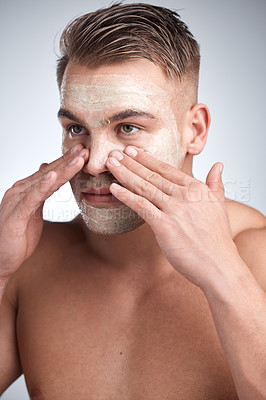 Buy stock photo Healthy, man and face mask in studio with cream for dermatology, skincare or treatment on gray background. Male person, cosmetics, with lotion for grooming, wellness routine or facial product